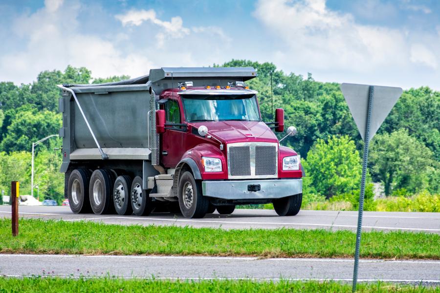 IRP Carriers Manual Large Dump Truck Delivering Gravel To Commercial Construction Site